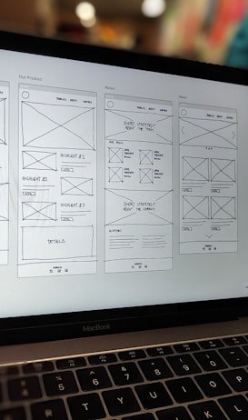 Laptop displaying wireframe website design – parlot AI strategic planning and workflow optimization